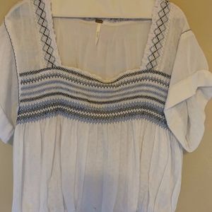Free People top w/short cuffed sleeve.